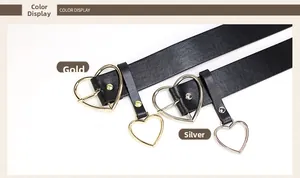 Detail view of black PU leather belts with gold and silver heart-shaped buckles and charms