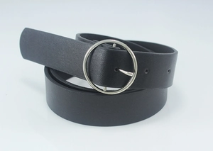 Close-up of black leather belt featuring a silver circular metal buckle and textured strap