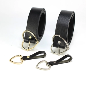 Black leather belt set for women featuring heart-shaped metal buckles in gold and silver