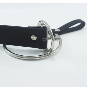 Women's black matte leather belt with large silver polished ring buckle on white surface