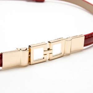 Elegant red patent leather skinny belt for women with a polished gold double square buckle