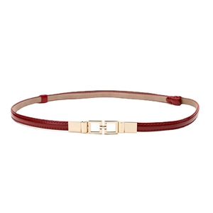 Slim red patent leather waist belt with elegant gold rectangular buckle for women