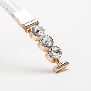 White faux leather belt for women with polished gold buckle and sparkling rhinestones