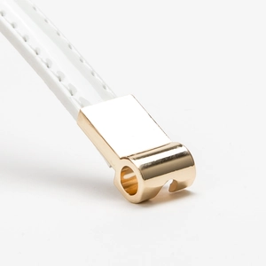 White faux leather belt with a polished gold rhinestone buckle for stylish women