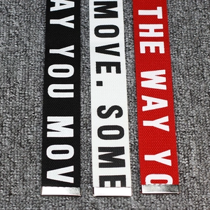 Industrial street style nylon canvas belts with bold slogan and silver metal tips