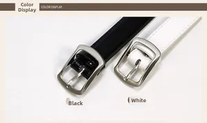 Detailed close-up of black and white skinny belts with square metal buckles and stitching