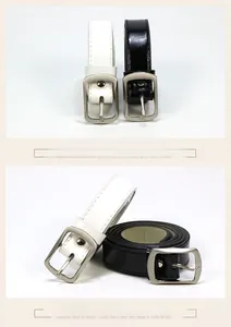 Detail view of minimalist slim leather belts in black and white with silver metal buckles