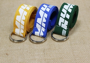 Detailed view of heavy-duty nylon web belts with double D-ring buckles and letter print