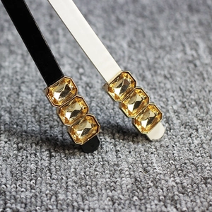 Sweet bow buckle skinny waist belt for women with amber crystals and gold metal claw setting