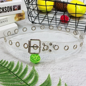 Close-up of a clear PVC waist belt featuring silver metal grommets and a square buckle