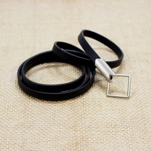 Minimalist black multi-layer silicone belt with a brushed silver square metal buckle