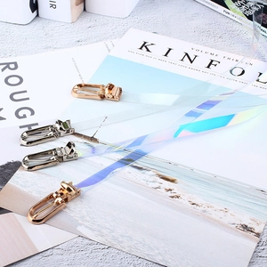 Cintura trasparente in PVC con finitura laser colorata e ganci metallici per donna