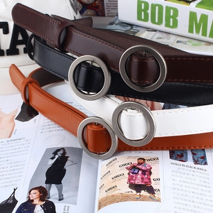 Three minimalist women belts in black brown and cream with round silver buckles