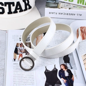 Minimalist white faux leather belt for women featuring a round gunmetal buckle on magazines