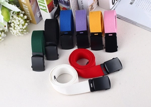 Detail shot of multicolor nylon canvas belts with matte black buckles for jeans