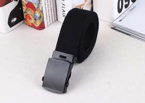 Close-up of a black nylon canvas belt with a matte black metal buckle and durable texture