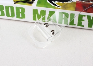 Detail of transparent PVC belt featuring two round silver metal rivets and a sleek finish
