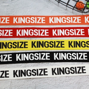 Five assorted colors of nylon canvas belts featuring kingsize print with double D-rings
