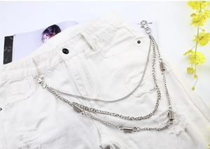 Close-up of triple-layered silver metal pants chain with spring charms and lobster clasps