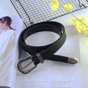 Vintage western style black leather belt with ornate silver floral buckle and tip decoration