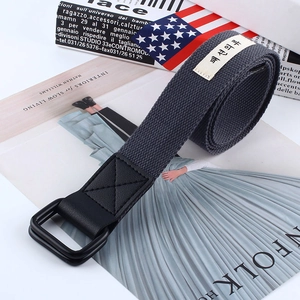 Detailed view of dark grey canvas belt with double D-ring buckle and reinforced stitching