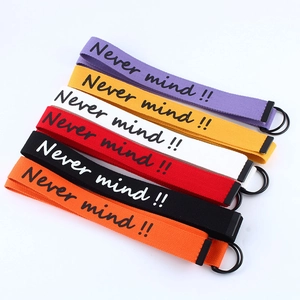 Colorful canvas belts with 'Never mind' print and double D-ring metal buckles in various shades