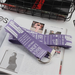 Close-up of a purple canvas belt with white text print and silver double D-ring buckle