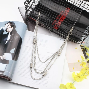 Close-up of triple-layered silver metal pants chain with punk style spring charms