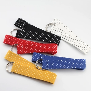Polka dot nylon canvas belts with silver double D-ring buckles in five vibrant colors