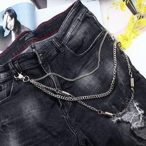 Macro view of double-layered silver metal pants chain with punk style spring charms