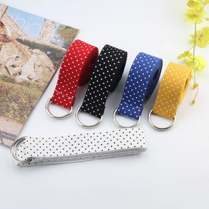 Five colorful polka dot canvas belts with double D-ring buckles for casual jeans