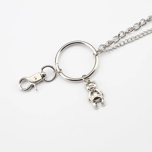 Detail of silver double metal pants chain with bear pendant and lobster clasps