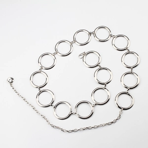 Detailed macro view of adjustable silver metal ring waist chain with lobster clasp