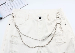 Close-up of double-layer silver metal hip hop pant chains with engraved letter tag detail