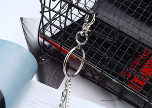 Close-up of double-layer silver metal trouser chain with lobster clasp and round ring detail