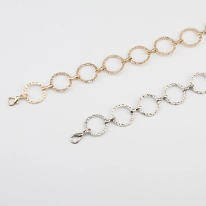 Minimalist gold and silver circular chain belts with hammered texture and lobster clasp