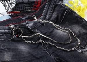 Close-up of triple-layered silver metal wallet chains with heavy industrial lobster clasps