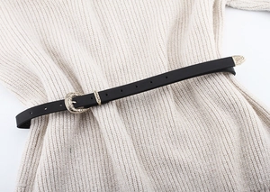 Vintage skinny black leather belt for women with ornate gold-tone engraved metal hardware