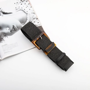 Women's black woven elastic belt with amber tortoiseshell buckle for casual dresses