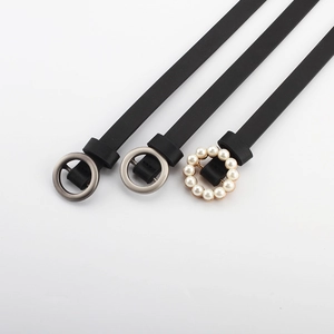 Three slim black leather belts with pearl and metal round buckles for women's dresses