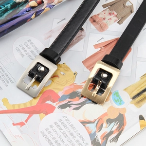 Retro slim black leather belts with vintage gold and silver square buckles on magazines