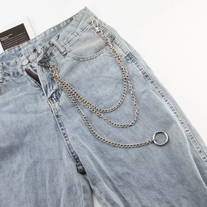 Close-up of triple-layered silver metal wallet chain with lobster clasps on blue denim