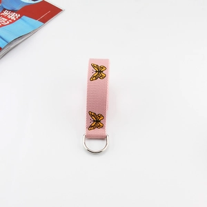Pink canvas belt with yellow butterfly embroidery and silver double D-ring buckle