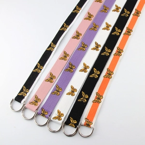 Multiple colors of canvas belts with double D-ring buckles and yellow butterfly prints