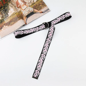 Canvas belt with pink flame print and silver double D-ring buckle on white background