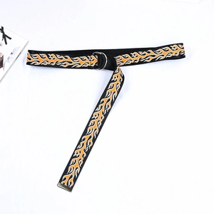 Detail view of canvas belt featuring double D-ring buckle and flame graphic print design