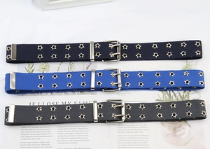 Detail of multi-color punk canvas belts with double-row star-shaped metal eyelets