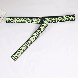 Detail of street style canvas belt with neon green flame print and double D-ring buckle
