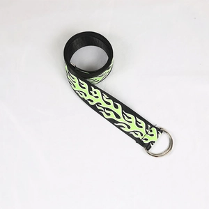 Detail of canvas belt with green flame patterns and silver double D-ring metal buckle