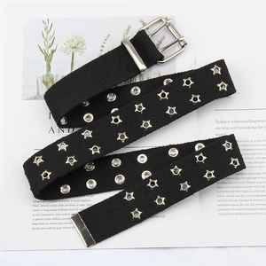 Detail of black canvas belt featuring double rows of star and round metal eyelets